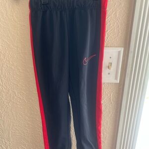 Nike Kids Black Joggers with Red Stripes